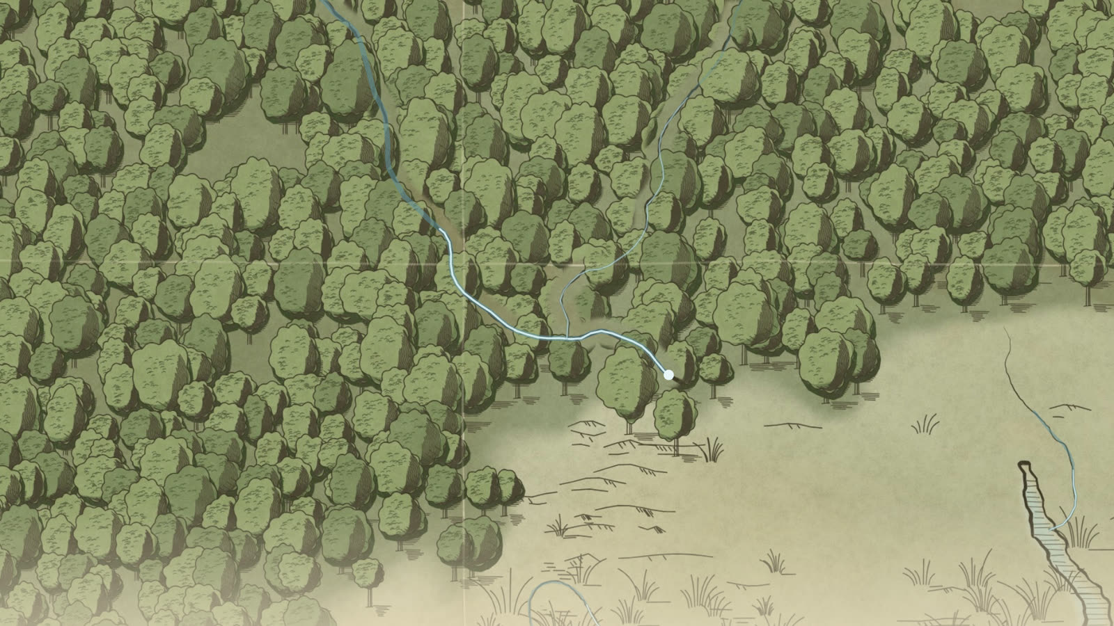 A river running out of a forest toward the sea